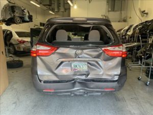 Photo showing damage to client's vehicle 