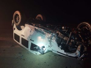 A car accident photo showing flipped vehicle.